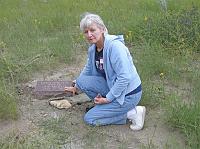  Marty Merlo-Kuepper-Koellner finds her grandmother Lena Girotti Merlo's grave site at the Dawson Cemetery. Lena was buried there in 1911. Marty's grandfather, Joe Merlo, was also a Dawson miner.